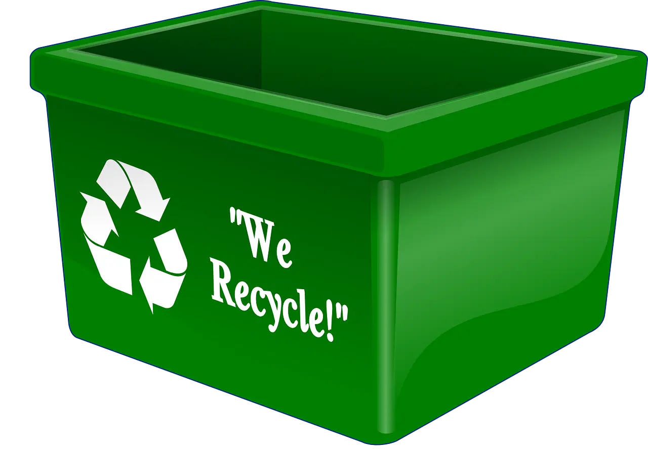 Green recycling box with recycling logo and text saying We Recycle